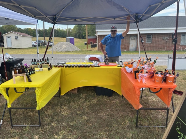 Sunset Holler Farms booth at farmers market